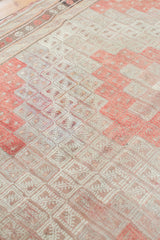Repeating geometric diamond guls on vintage Jijim flatweave, with ivory and faded cinnabar tones.
