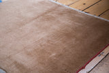 Luxurious camel bronze wool pile with natural sheen from a vintage Chinese rug.