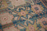 Vintage Indian rug detail: Arts & Crafts palmette motif, peach rose, sky blue, moss green, abrash.
