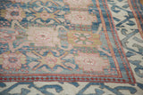 Peach palmette motifs on sky blue field, with red pearl and aqua blue borders.
