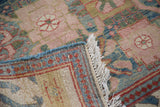 Hand-knotted foundation, cream fringe, and arts and crafts palmette design in peach rose.