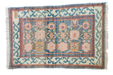 Vintage Indian hand-knotted rug, sky blue field, allover palmette motif, aqua, ivory, red.