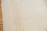 Hand-woven texture and subtle ivory to silver stripe pattern on the modern kilim.