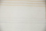 Visible hand-woven kilim texture in ivory with light beige stripe detail.