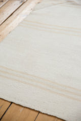 Vintage hand-woven kilim texture with subtle ivory and silver stripe design.