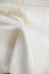 Hand-woven modern kilim flatweave texture in varying ivory and silver stripe tones.