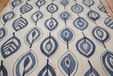 Jean blue and deep denim flayed leaf motif on the ivory New Kilim rug.