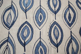 Hand-woven Kilim rug featuring expressive jean blue and denim flayed leaf motif on ivory.