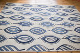 Detail of new Kilim rug's flayed leaf motif in jean and denim blue tones.