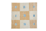 Geometric New Kilim square rug with saffron gold, ivory checker pattern, abrash blue center squares.