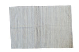 New Kilim rug featuring an allover textural pattern in shades of ivory, grey, and silver.
