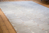 Textural view of the gray New Kilim carpet with unique striped design and tan accents.