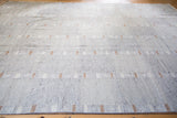 Unique modern striped Kilim rug in subtle gray with off-white and beige accents.