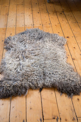Fluffy, curly texture of the luxurious natural grey Angora wool throw.