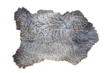 Luxurious Angora wool throw rug, super soft with fluffy curly grey and silver texture.