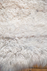 Shaggy off-white angora wool pile texture, revealing its super soft, luxurious feel.