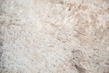 Soft angora wool rug with luxurious fluffy cream and light beige pile.