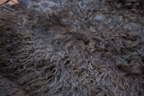 Luxurious dark grey angora wool with a distinctive curly pile.