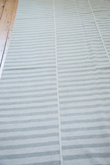 Textured minimalist stripes in light ivory and gray on the new Kilim rug.