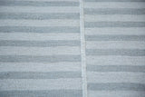 Flatweave Kilim rug with light ivory and gray striped columns and vertical join.