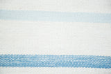Detail of hand woven kilim texture with distinct light and darker blue stripes.