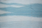 Abstract channels pattern in powder blue and ivory on the hand-woven Egyptian wool kilim.