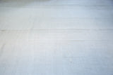Vintage hand-seamed hemp Kilim rug showing flat-woven platinum white panels.