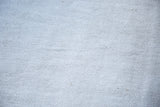 Hand-woven vintage hemp kilim carpet texture in soft iridescent platinum white and silver.
