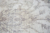 Distressed vintage Sivas carpet texture with exposed foundation and faded palmette motifs.