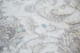 Distressed vintage Sivas carpet showing exposed foundation and faded palmette pattern.