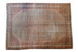 Distressed Mir Serbend Persian carpet with allover design in muted blue and light red.