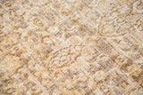 Distressed hand-knotted Khorossan rug showing foundation, with faded gold, bronze, and ivory patterns.