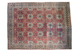 Vintage Birjand hand-knotted carpet, softened red and aqua blue repeating floral motifs.