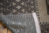 The dense hand-knotted foundation and back weave of the vintage Afghani Ersari carpet.