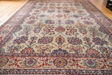 Distressed Kazvin carpet with intricate ruby, navy floral palmettes and Arabesque border.