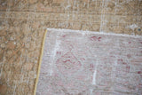 Distressed sandy bronze pile and subtle pattern on woven Malayer foundation.