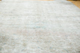 Blanched sun-kissed fade on the intricate worn texture of the distressed Tabriz rug.