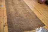 Distressed texture and overdyed bronze, chestnut, aqua tones on vintage Oushak runner.