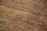 Distressed Oushak runner pile showcasing overdyed bronze and chestnut texture.