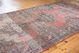 Worn character of a vintage Oushak runner, with faded rose and gray geometric medallions.