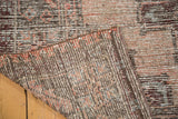 Hand-knotted foundation and worn, abrash-rich pile of a distressed Oushak rug.