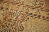 Distressed texture of antique Yomud carpet with nomadic geometric guls and exposed foundation.