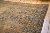 Detail of distressed antique Yomud carpet with exposed foundation and repeating guls.