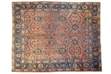 Vintage Mahal rug, sprawling palmette and leaf pattern, rose terracotta field, navy blue borders.