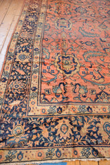 Vintage Mahal rug corner: intricate navy border, rose field, teal leaves, bronze motifs.