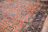 Vintage Mahal carpet: navy blue border with gold, rose, and bronze patterns next to the rose field.