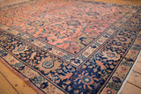 Vintage Mahal carpet's navy border, rose field, teal leaves, and bronze palmettes.