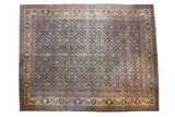 Distressed Tabriz carpet, allover navy Herati pattern, oxidized copper green and rust red borders.