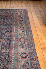 Distressed Tabriz carpet border with samovar turtle motifs on time-softened copper green.