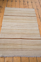 New vintage inspired Kilim flatweave rug, featuring horizontal bronze and ivory earth tone bands.